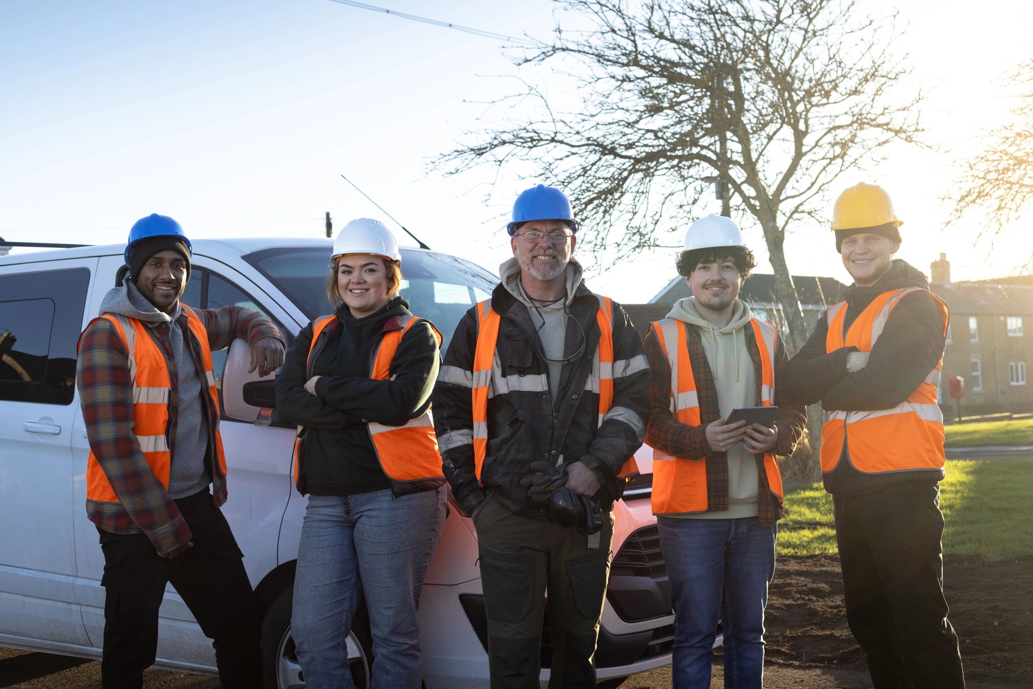 Electrical contracting team standing together on site